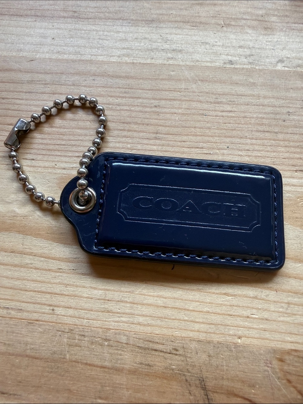 Dark Blue Patent Leather Coach Tag